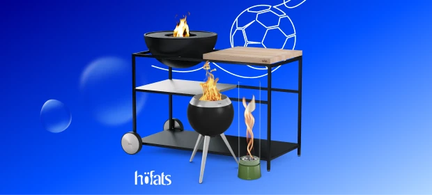  Runder Grill mit Gemüse, Brot und weiteren Speisen über offenem Feuer. 